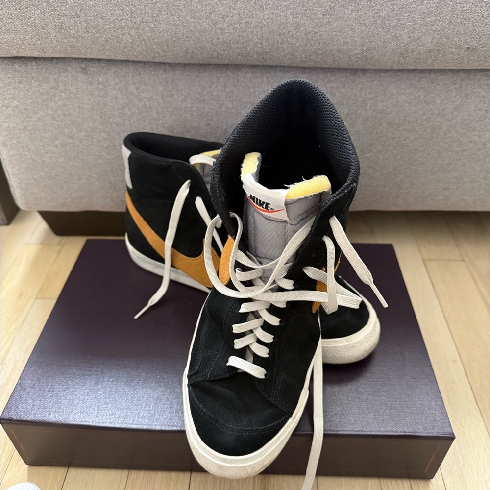 Nike women’s Black and Gold Sneakers
